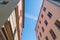 Low angle shot of pink buildings under blue sky on a sunny day