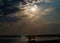 Low angle shot of a reflective lake under a bright moonlight