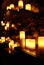 Low angle shot of a relaxing room with glowing candles on wooden drawers attached on the wall