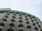 Low angle shot of rows of round balconies on a building