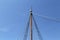 Low angle shot of a sailing ship mast on a sunny day