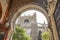 Low angle shot of the Seville Cathedral in Spain captured from an arch below