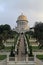 Low angle shot of the Shrine of the Bab in Haifa Israel surrounded by trees under a cloudy sky