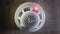 Low angle shot: The smoke detector is triggered by a trickle of dum, the red indicator lights up