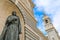 Low angle shot of a statue in front of the Almudena Cathedral Catholic Church in Madrid, Spain