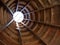 Low angle shot of a symmetrical wooden structure with a hole at the end