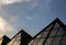 Low angle shot of three pyramid buildings in a glass facade under the beautiful sky