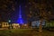 Low angle shot of Turin, Italy at night showing the illuminated Mole Antonelliana building