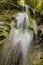 Low angle shot of a waterfall at the entrance of the Gorges de la Jogne in Switzerland