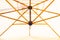 Low angle shot of a white beach patio umbrella  with wooden ribs