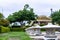 Low angle shot of zen garden with a blurred buddhist stupa in background. Buddhism and zen concept