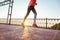 Low angle of sporty female runner jog outdoors