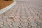 Low angle stained brick paver driveway