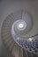 Low-angle of stunning spiral English staircase with intricate designs