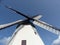 Low angle of a tall windmill with a blue sky background on Bornholm island