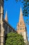 Low angle upward view of St. Paulâ€™s Cathedral along Swanston Street