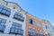 Low angle view of adjacent houses with window railings in San Francisco, California