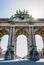 Low angle view of the arcade du Cinquantenaire in backlighting in Brussels, Belgium