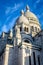 Low angle view of the Basilica of the Sacred Heart of Paris against blue sky