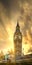 Low angle view of the Big Ben Tower of Parliament in Westminster at sunset with clouds and sun rays.
