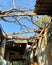 Low angle view of broken roof of abandoned building