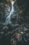 Low angle view of Burgbach Wasserfall with rocky cascade in Germany