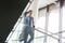 Low angle view of businessman moving down on staircase at office