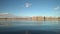 Low angle view of a calm lake in Colorado with stand up paddler