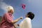 Low Angle View Of A Couple Flying Kite