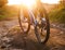 Low angle view of cyclist riding mountain bike trail at sunrise