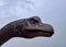 Low Angle View of Dinosaur Head Against Cloudy Sky