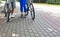 Low angle view of Fit senior couple walking with bicycle in park