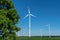 Low angle view of five wind power turbines, part of a wind farm, on a green field in eastern Germany near the city of Cottbus.