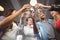 Low angle view of happy colleagues toasting with champagne