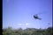 Low angle view helicopter landing in field