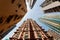 Low angle view of high-rise residential towers with crowded narrow apartments