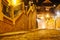 Low angle view of Liars Bridge Podul Minciunilor and car passage towards Small Square in Sibiu, Romania, at night.