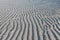 Low angle view of line pattern on sand created by waves in Belitung Island beach, Indonesia