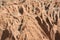 Low angle view of man standing on the rocky cliff