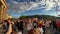 Low angle view of massive columns of Brandenburger Tor. Tilt down and pan reveal of people enjoying atmosphere of