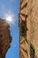 Low angle view of a medieval street with the sun\\\'s rays visible in lens flare and illuminating