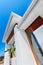 Low angle view of a modern mansion with blue sky background