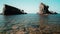 Low angle view of natural landmark The stone ships near Sinemorets, Bulgaria. Colorful landscape of rocks in calm blue sea water