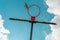 Low angle view of old basketball board and hoop with torn net