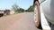 Low Angle View Outside Car Near Tire Driving On Road in Africa