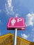 Low Angle View of Pink Sign of Reserved Parking Area for Ladies at Day Time