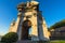 Low angle view of Porta Pia surrounded by bushes under the sunlight in Ancona in Italy