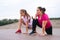 Low-angle view of professional fitness female trainer have personal training with motivated overweight young woman