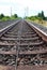 Low angle view from a railroad track to the horizon