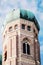 Low angle view of rounded green dome on tower